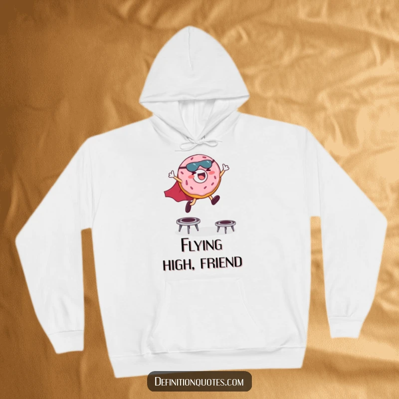 Funny hoodie illustration of a giggling donut character wearing a superhero cape, energetically leaping over small trampolines.