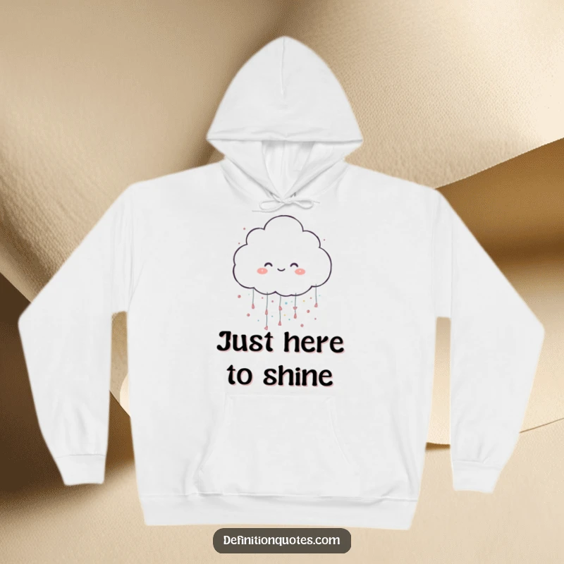 Funny hoodie showcasing a happy cloud character playfully raining large, dazzling glitter, perfect for cozy, magical moments.