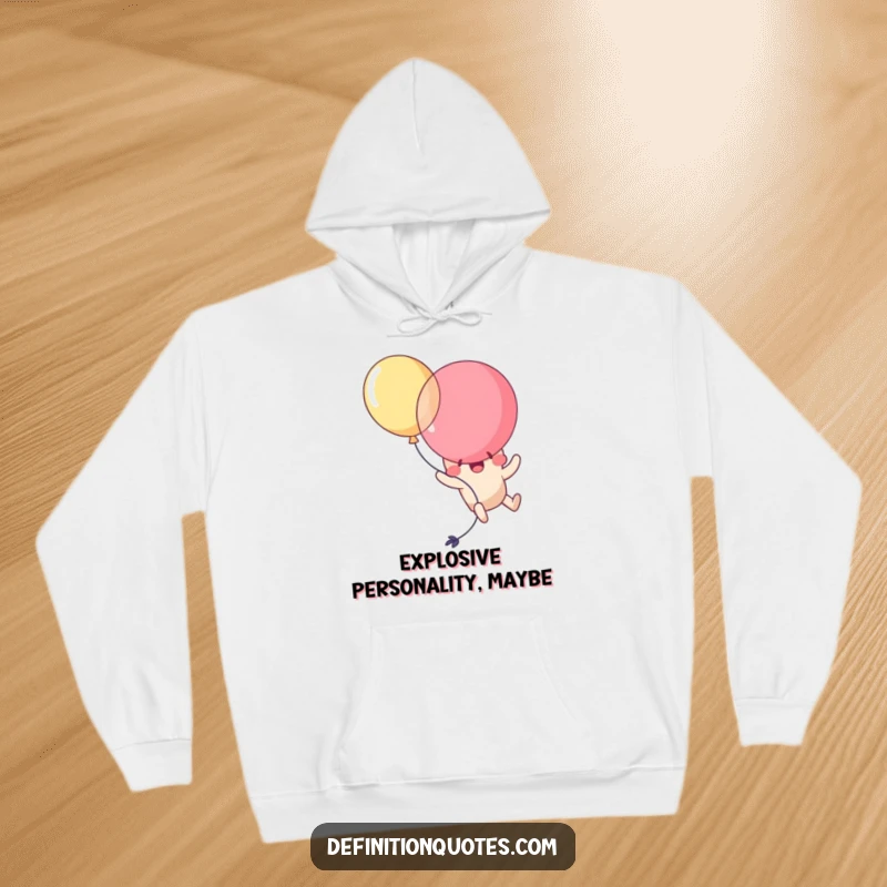 Funny Kawaii balloon character comically popping itself mid-air, looking surprised and delighted. A humorous and cozy hoodie.