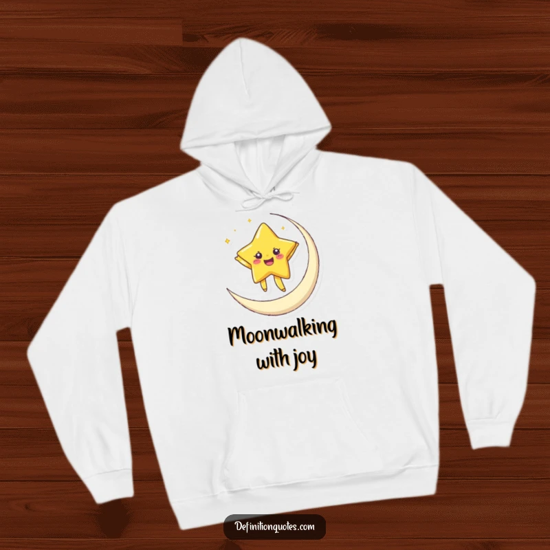 Funny hoodie depicting a joyful, twinkling star dancing on a crescent moon, offering cozy celestial vibes and humor.