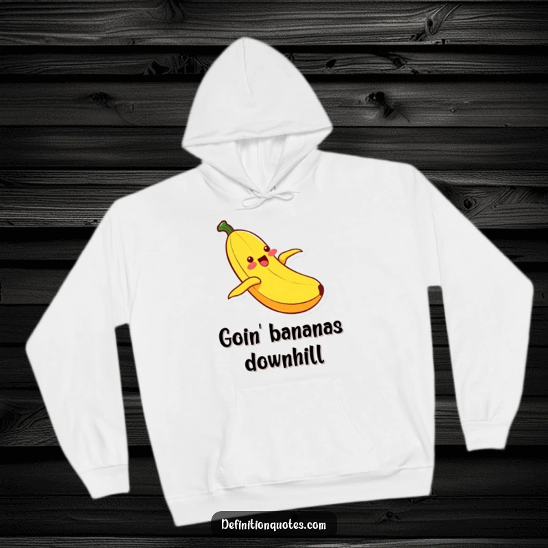 Funny Kawaii banana character gleefully sliding down its peel, offering a warm and humorous design on a cozy hoodie.