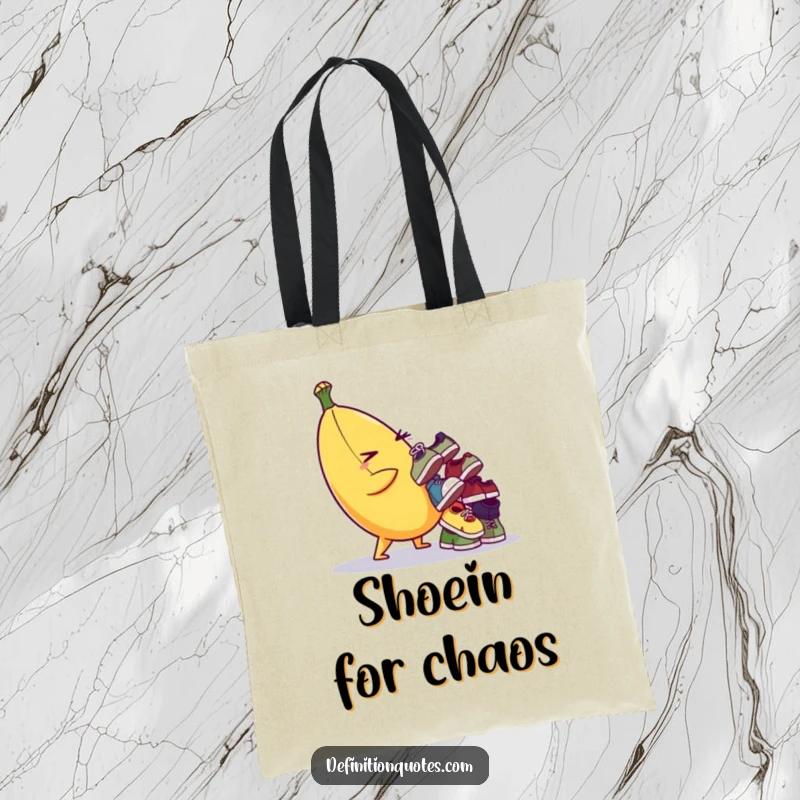 Funny tote bag with a winking banana character balancing a teetering stack of tiny, mismatched shoes. Practical and amusing.